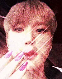 image description: a card displaying a person looking at the camera, as if taking a selfie. there is an emoji of pink-painted nails overlayed on top of the image, and sharp flash making the card pop. end image description.